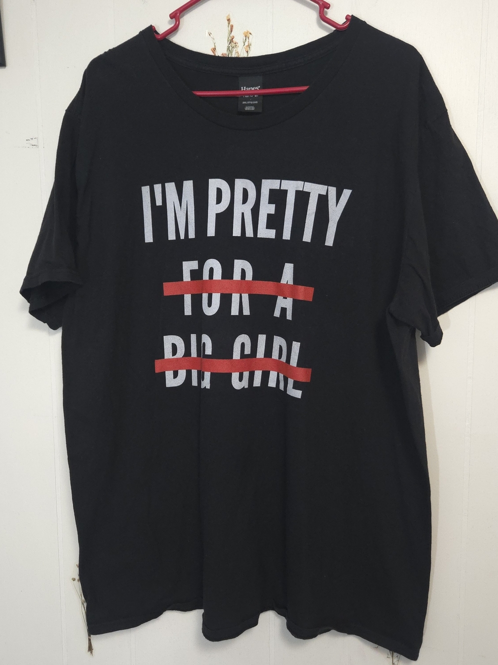 Hanes Black Short-Sleeve Tee with White Text and Red Strikes